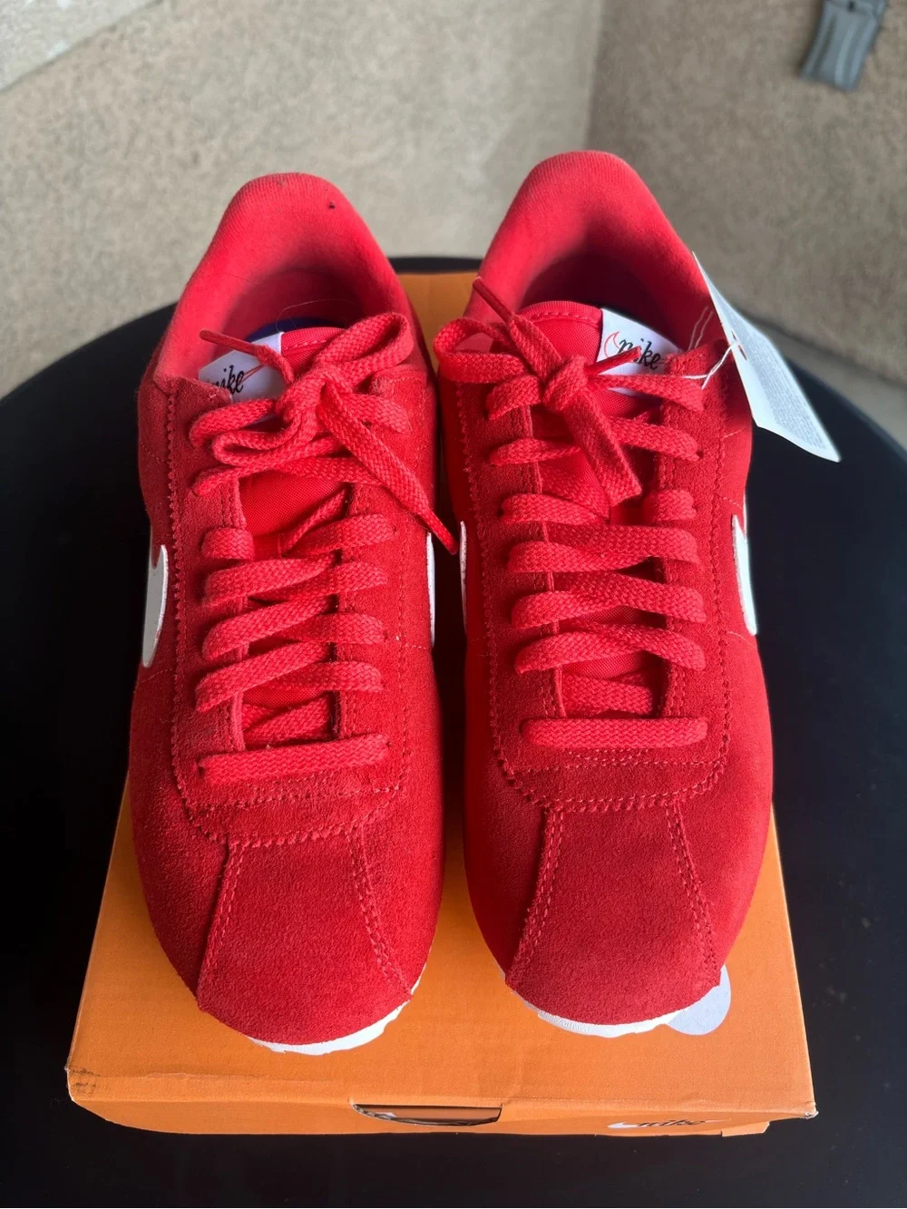 Nike women’s Red Suede Athletic Sneakers with White Swoosh